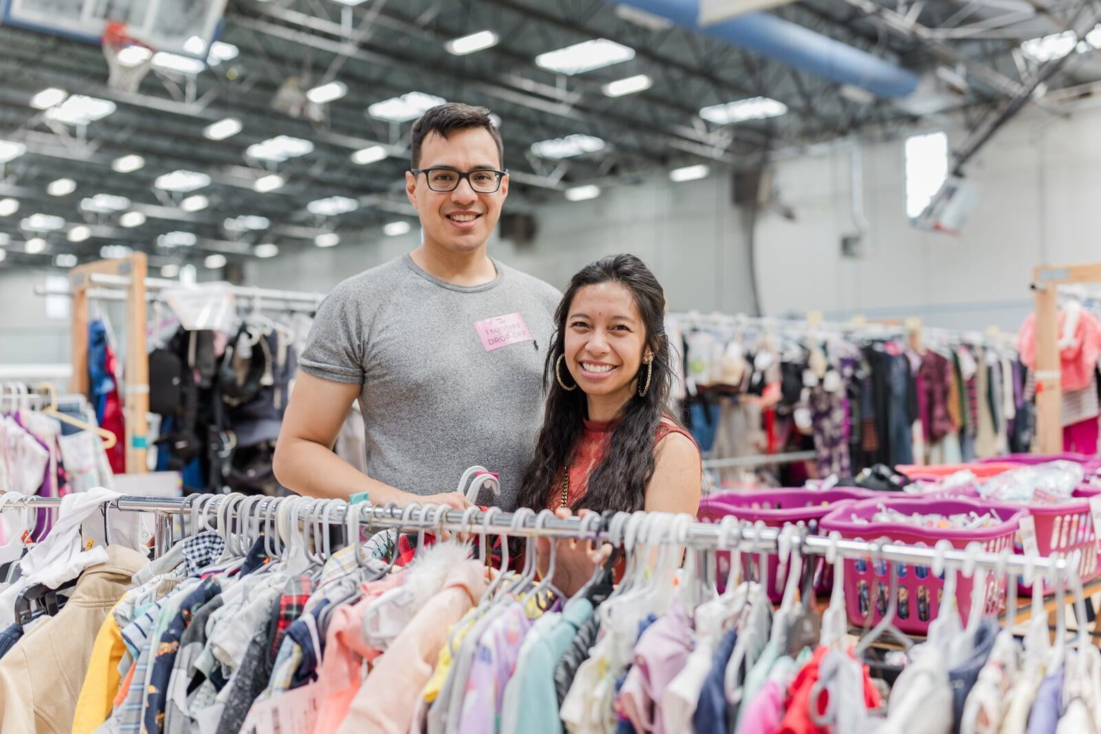 Husband and wife shopping for their baby